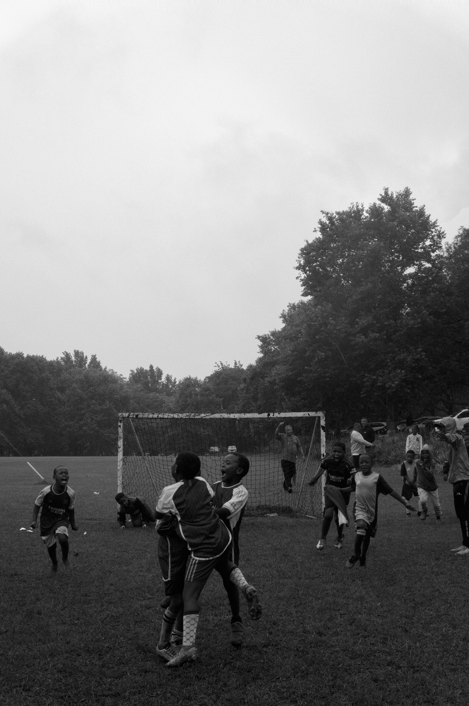 Boys celebrating a soccer goal